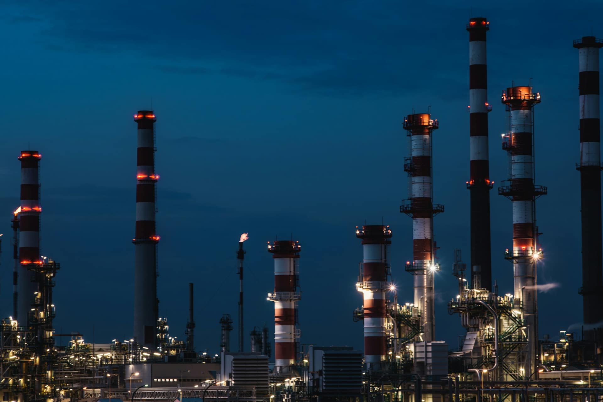 Industrial refinery infrastructure at dusk